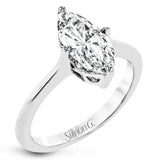 This solitaire ring design is built to perfectly showcase a beautiful marquise shaped center stone.