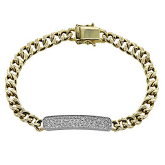 Dazzle in this 18K two tone ID bracelet with 0.66 ctw of diamonds and a chain link detail