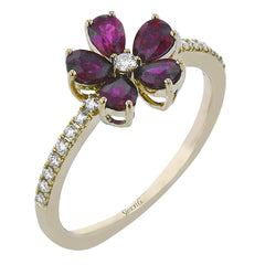 This delicate right hand ring has a flower design with petals of pear-shaped sapphires 1.06 ctw., with a diamond center and shank 0.13 ctw.