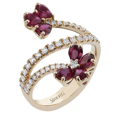 This right hand ring wraps the finger in 0.41 ctw. of diamonds set in 18K rose gold, and is adorned with petals of pear-shaped Rubies 1.52 ctw.