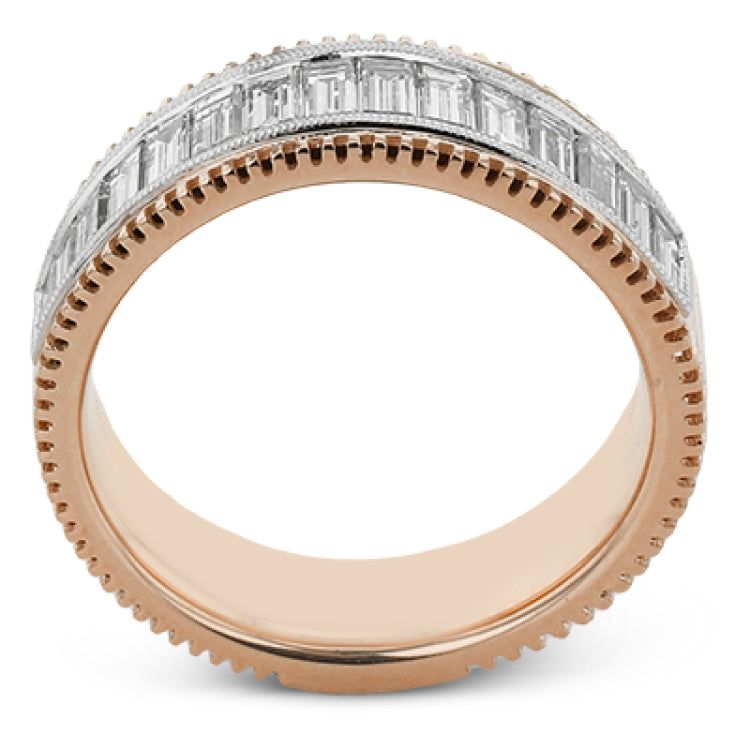 This two-tone right hand ring has a ribbed yellow gold band and sparkles with a row of baguette diamonds 1.0.7 ctw, accented by a delicate white gold beaded channel.