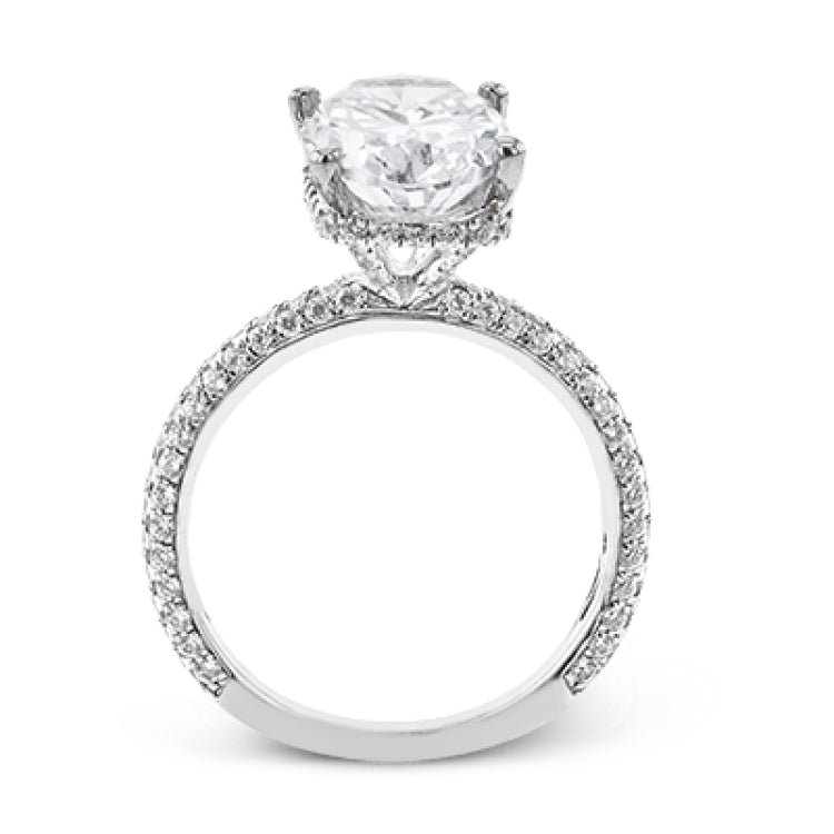This stunning engagement ring  from our under halo collection is made for an oval center diamond, and set with 0.80 ctw of pave set diamonds in 18 kt white gold.