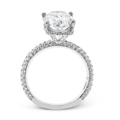 This stunning engagement ring  from our under halo collection is made for an oval center diamond, and set with 0.80 ctw of pave set diamonds in 18 kt white gold.