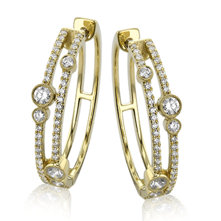 These whimsical 1.0 ctw diamond hoops have 2 rows of diamonds and are accented with larger bezel set diamonds for a modern twist