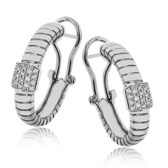 This elegant huggie earring in 18K yellow gold has a ribbed design and accented with 0.24 ctw. of pave set diamonds in white gold, and a lever back closure