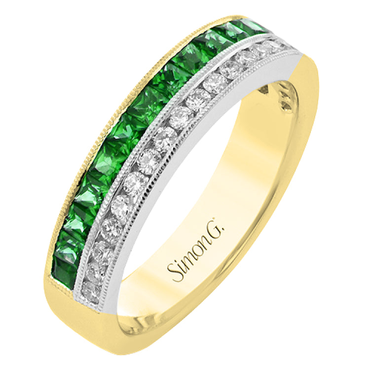 This 18K white and yellow gold band features .77cttw emeralds and .28cttw diamonds.