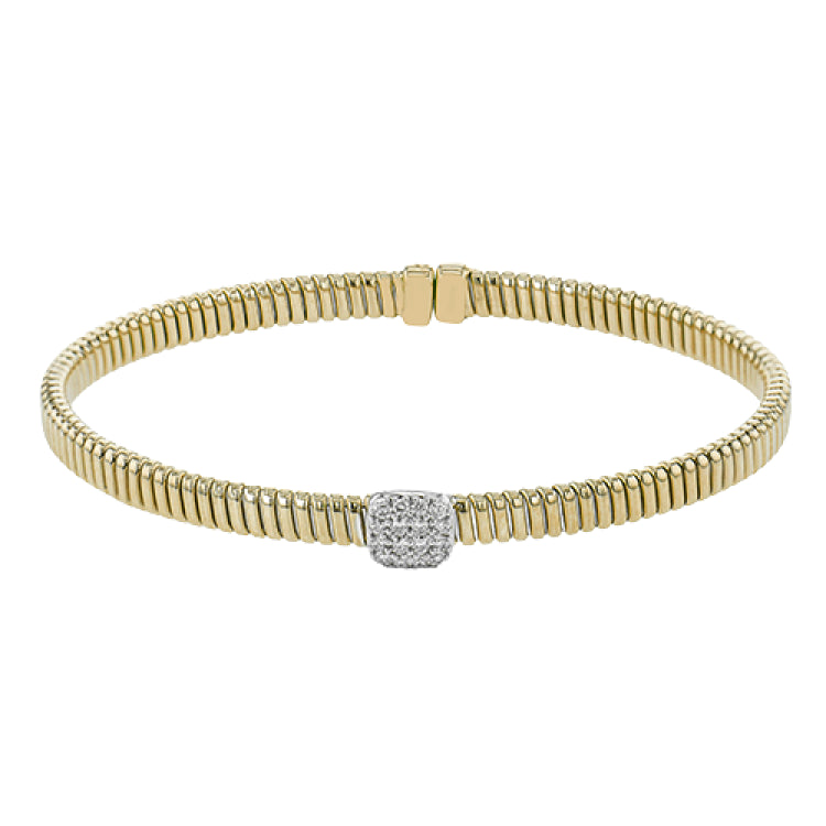 This modern design 18k yellow gold textured bangle with .19ctw diamonds set in a cushion shape and magnetic closure, is perfect for stacking