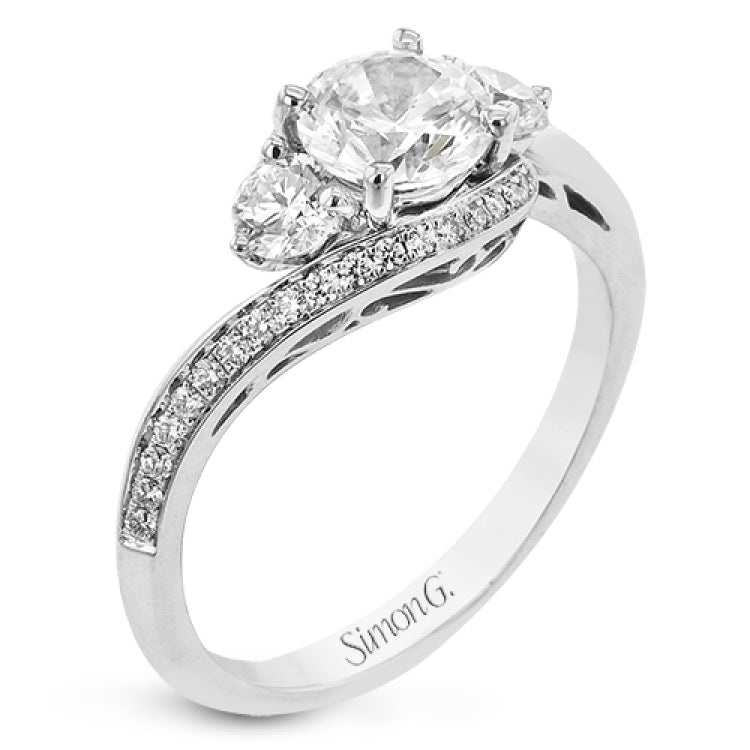 This beautiful ring features a three stone design with 2 side stones 0.33 ctw., set in a vintage-inspired shank. A diamond accented knife edge curved band .15ctw, and is perfect for those who want a classic look with a unique twist.