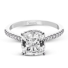 This 18K engagement ring from our under halo collection evokes understated elegance, with 0.30 ctw of delicate diamonds on the shank, the lower halo, and the bridge.