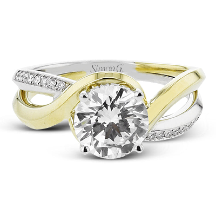 18K two-tone engagement ring has a delicate swirl design with a polished yellow gold side, and a white gold side set with 0.14 ctw of diamonds