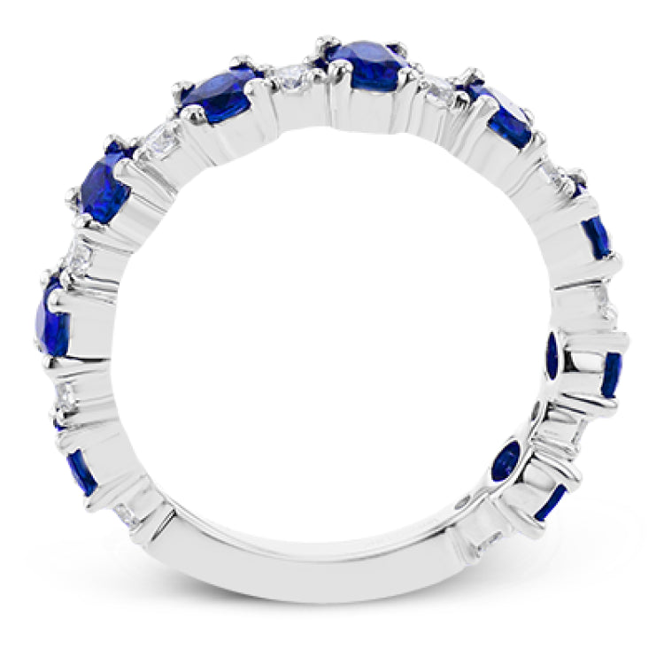 The perfect addition to any stack or bold enough to stand alone, this 18K white gold band showcases 1.69cttw oval sapphires and .35cttw diamonds.