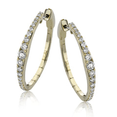 Dress up your classic button down with these 18K yellow gold hoops featuring .97cttw diamonds.