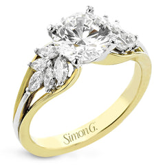 18 kt. floral inspired engagement ring has a yellow gold split shank and marquise side diamonds of .41 ctw set in white gold, along side the center stone creating the look of glimmering leaves