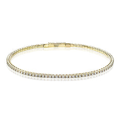 Dress up any outfit with this yellow gold diamond bangle gleaming with 1.5 ctw of round brilliant diamonds.