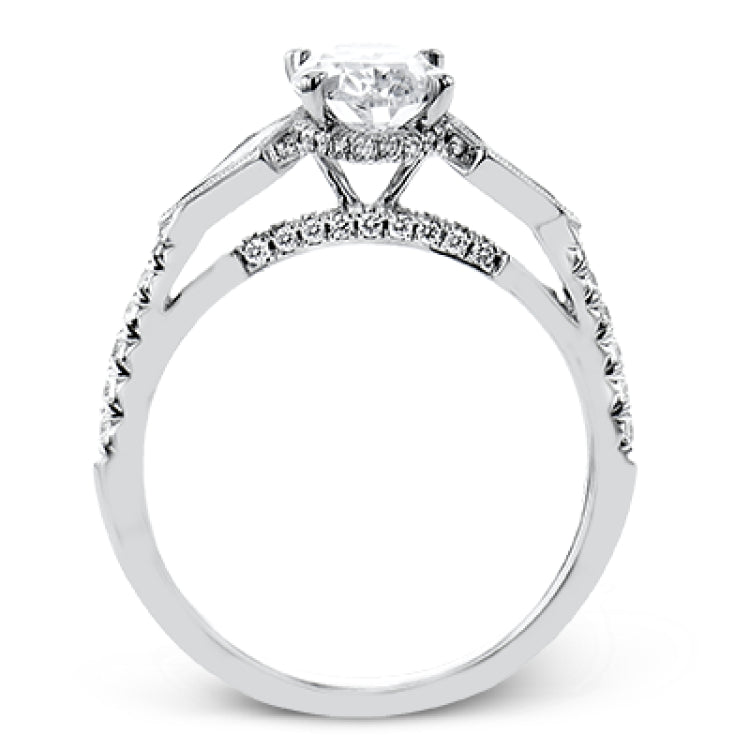 This modern 3 stone engagement ring is made for an oval center and flanked by 2 kite set diamonds 0.23 ctw, with round prong set diamonds along the shank 0.22 ctw.
