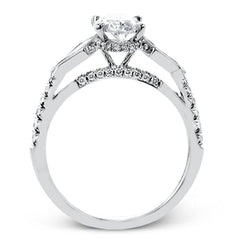 This modern 3 stone engagement ring is made for an oval center and flanked by 2 kite set diamonds 0.23 ctw, with round prong set diamonds along the shank 0.22 ctw.