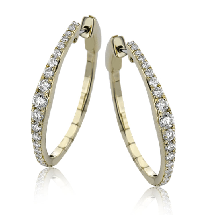 Dress up your classic button down with these 18K white gold hoops featuring .97cttw diamonds.