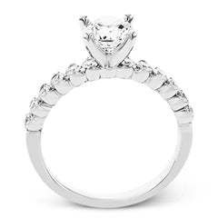 18K diamond engagement ring 0.50 ctw., features a half bezel setting on each individual side diamond which adds a modern bubble look to this ring