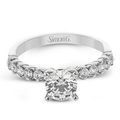 18K diamond engagement ring 0.50 ctw., features a half bezel setting on each individual side diamond which adds a modern bubble look to this ring
