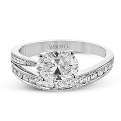 This modern engagement ring from our Lightning collection showcases a row of channel set diamonds 0.35 ctw., in a dynamic design featuring an Oval main center diamond.