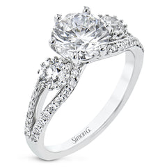 This 3 stone engagement ring has a split shank design and 2 side diamonds 1/4 ct each, totaling 0.48 ctw. and outlined with diamond accents of .35 ctw.