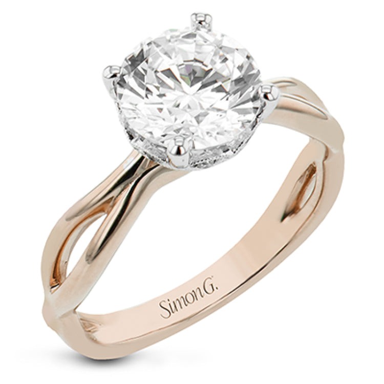 Simplicity meets modern in this two-tone engagement ring with a yellow gold split shank, and diamond accent lower halo 0.04 ctw set in white gold