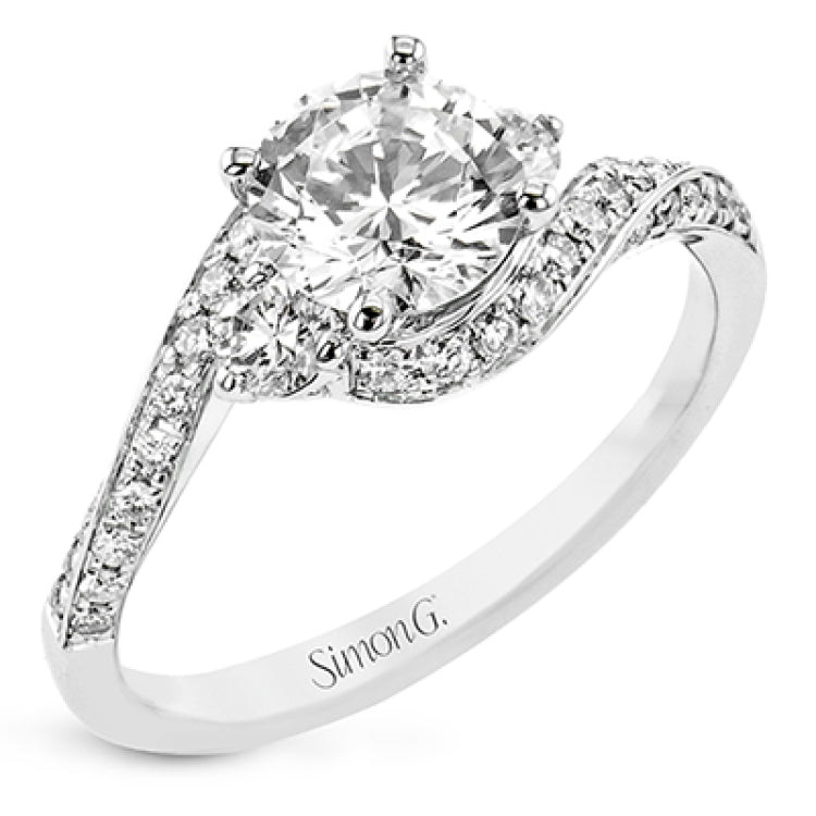 Contemporary 18 kt white gold engagement ring has a subtle knife edge and 2 diamonds of .21 ctw flanking the center, accented with a swirl of round diamonds .27 ctw