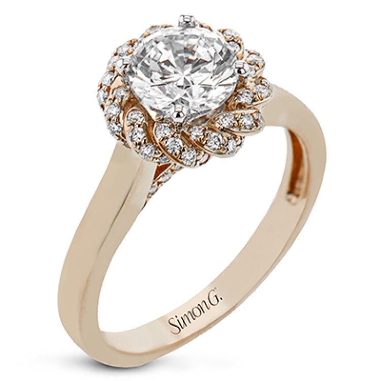 An 18k engagement ring with a new take on the classic solitaire design, features a twisted diamond halo 0.31 ctw., and high polished yellow band