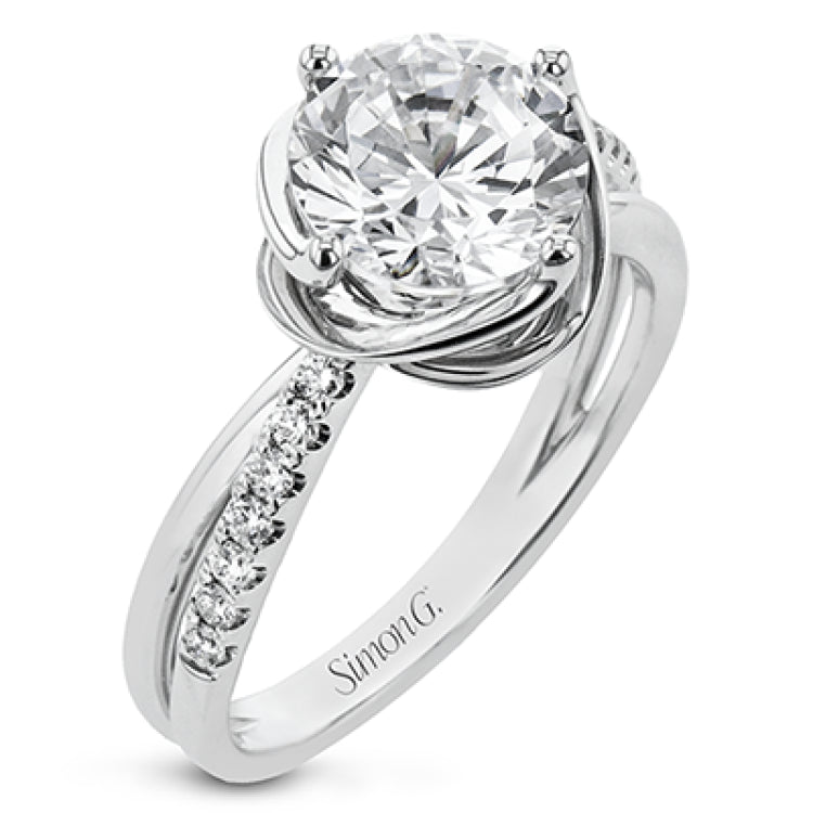 This criss-cross design engagement ring shimmers with 0.15 ctw round diamonds and a halo of gold strands wrapped around the center