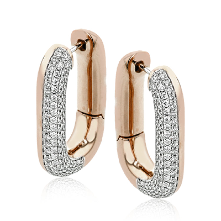 An every day classic, these 18K white and yellow gold earrings feature .79cttw diamonds.