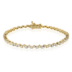 A modern take on the diamond tennis bracelet, in 18K yellow gold with 2.0 ctw of white diamonds adds a touch of sparkle to any outfit.