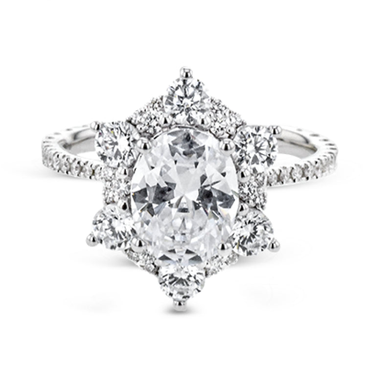 Like a crystallized explosion of light, this remarkable engagement ring design features a supernova of .60 ctw of diamonds surrounding the oval shaped center stone, as well as .38 ctw of smaller diamonds down the band.