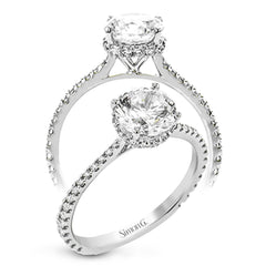 Part of our Underhalo Collection, this engagement ring contains the perfect touch of white diamonds that wink from underneath the center stone setting as well as down the sides of the ring.