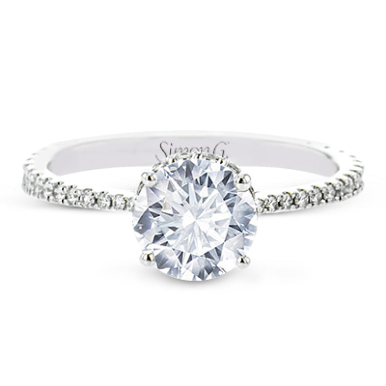 Part of our Underhalo Collection, this engagement ring contains the perfect touch of white diamonds that wink from underneath the center stone setting as well as down the sides of the ring.