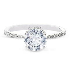 Part of our Underhalo Collection, this engagement ring contains the perfect touch of white diamonds that wink from underneath the center stone setting as well as down the sides of the ring.