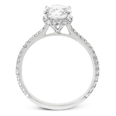 Part of our Underhalo Collection, this engagement ring contains the perfect touch of white diamonds that wink from underneath the center stone setting as well as down the sides of the ring.