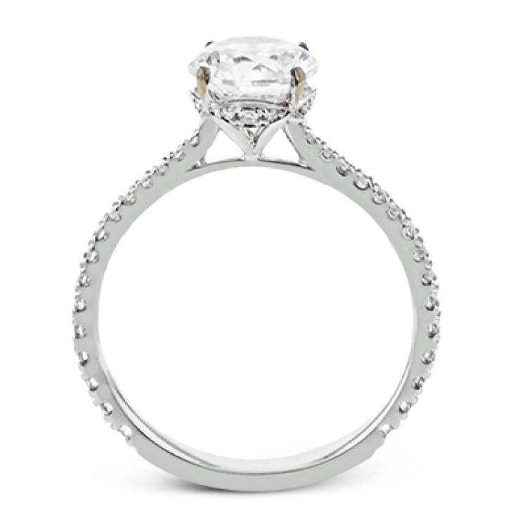This new take on a classic engagement ring setting is part of our Underhalo Collection, where a circle of diamonds sits snugly around the side of the center stone, giving the perfect touch of sparkle from every angle.