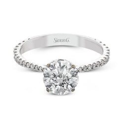 This new take on a classic engagement ring setting is part of our Underhalo Collection, where a circle of diamonds sits snugly around the side of the center stone, giving the perfect touch of sparkle from every angle.