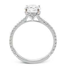 This new take on a classic engagement ring setting is part of our Underhalo Collection, where a circle of diamonds sits snugly around the side of the center stone, giving the perfect touch of sparkle from every angle.