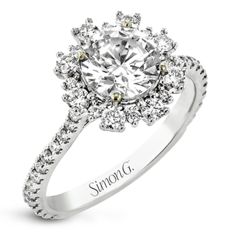 From our Super nova collection this 18K engagement ring is a unique take on the classic halo ring, and features 0.60 ctw of round diamonds