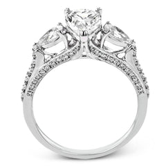 Pear shaped side stone set horizontally give this 18k white gold engagement ring a modern feel, accentuating the pear shape center stone.