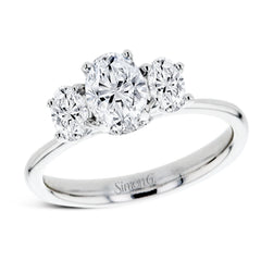 This 18k white gold engagement ring is a updated take on a classic three stone design, this time rendered with three sparkling oval shaped diamonds.