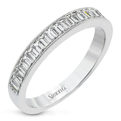 This sleek anniversary band features brilliant baguette cut diamonds 0.56 ctw., set with a delicate millgrain edge from our Simon set collection