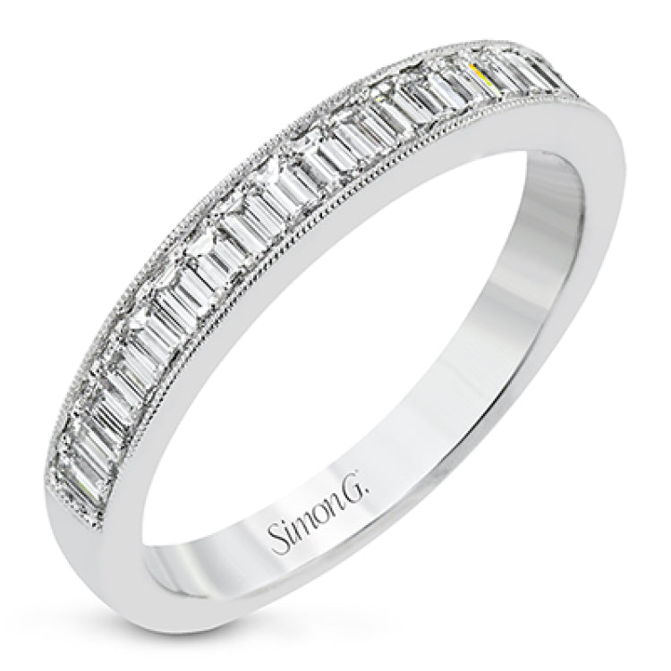 This sleek anniversary band features brilliant baguette cut diamonds 0.56 ctw., set with a delicate millgrain edge from our Simon set collection
