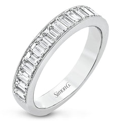 This gorgeous anniversary band is the perfect selection for those who seek a luxurious style to accompany any engagement ring, it features 1.06 cttw baguette diamonds with milgrain edges