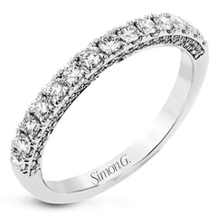 A classic, this 18K white gold diamond band features .57cttw white diamonds.