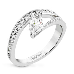 A marquise diamond set at an angle creates a contemporary look in this wonderful ring from our Lightning Collection.