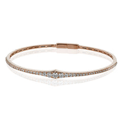 This bangle is a new take on a classic with a slightly tapered design and .88 ctw of white diamonds.