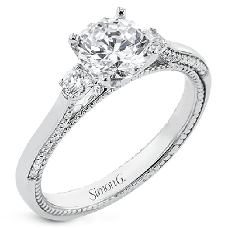 Diamond side stones, milgrain and diamond detailing on the sides of the ring add to the beauty of this unique engagement ring.