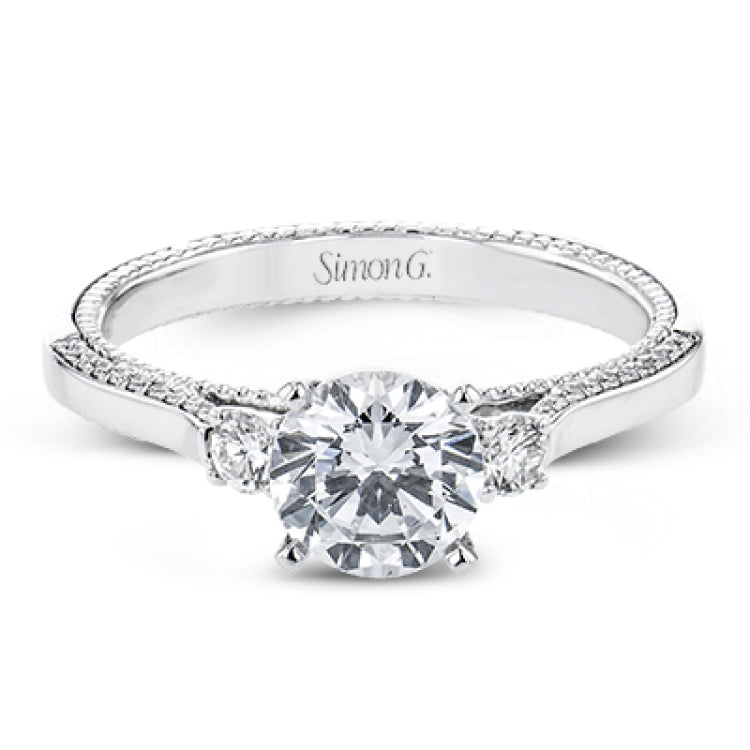 Diamond side stones, milgrain and diamond detailing on the sides of the ring add to the beauty of this unique engagement ring.